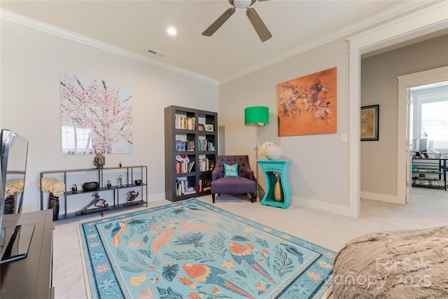 sitting room featuring baseboards, visible vents, carpet, a ceiling fan, and ornamental molding
