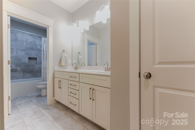 full bathroom featuring shower / tub combo with curtain, a sink, double vanity, and toilet
