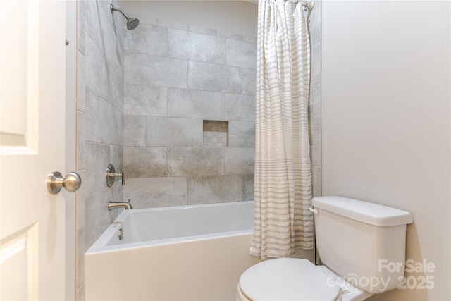 full bathroom featuring shower / bath combo and toilet