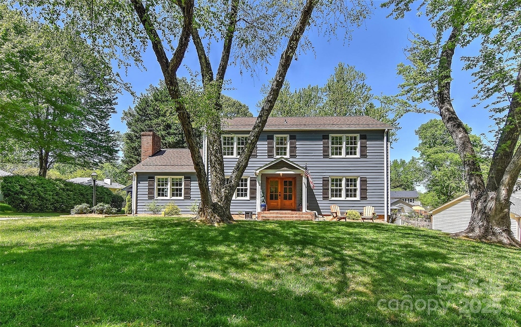 218 Kimrod Ln, Charlotte, NC 28270 - colonial inspired home with french doors, a front lawn, and a chimney