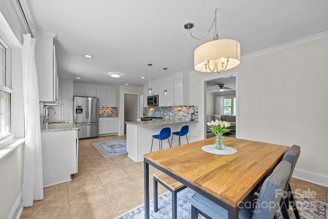 dining area with light tile patterned flooring, baseboards, ceiling fan, and recessed lighting