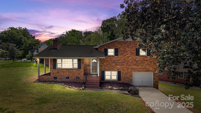 5301 Baker Dr, Charlotte, NC 28210 - split level home with a front yard, an attached garage, a chimney, concrete driveway, and brick siding