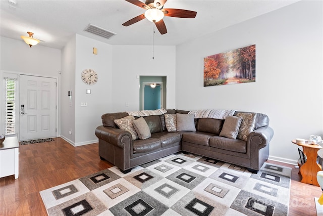 living area featuring ceiling fan, baseboards, wood finished floors, and visible vents