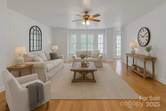 63 Frost Ln, Taylorsville, NC 28681 - living room with healthy amount of natural light, a ceiling fan, wood finished floors, and baseboards