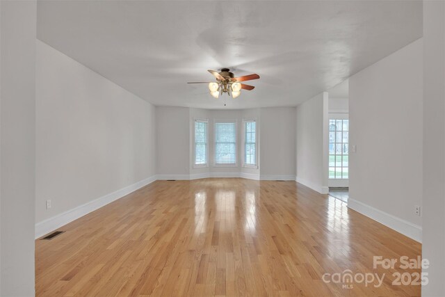 63 Frost Ln, Taylorsville, NC 28681 - unfurnished room with a ceiling fan, light wood-type flooring, and baseboards