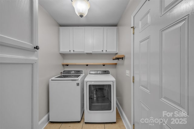 63 Frost Ln, Taylorsville, NC 28681 - laundry area featuring separate washer and dryer, cabinet space, baseboards, and light tile patterned floors