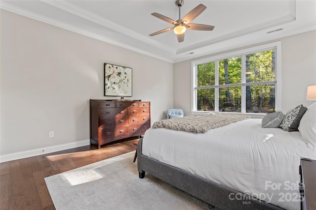 4012 Brandywine Ter, Lancaster, SC 29720 - bedroom with wood finished floors, a raised ceiling, crown molding, and baseboards