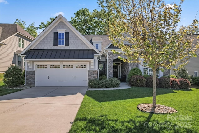 4012 Brandywine Ter, Lancaster, SC 29720 - craftsman-style house with a standing seam roof, concrete driveway, a front lawn, and stone siding
