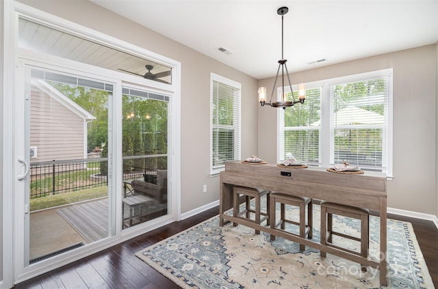 3028 Quinebaug Rd, Fort Mill, SC 29715 - dining space with dark wood finished floors, plenty of natural light, visible vents, and baseboards