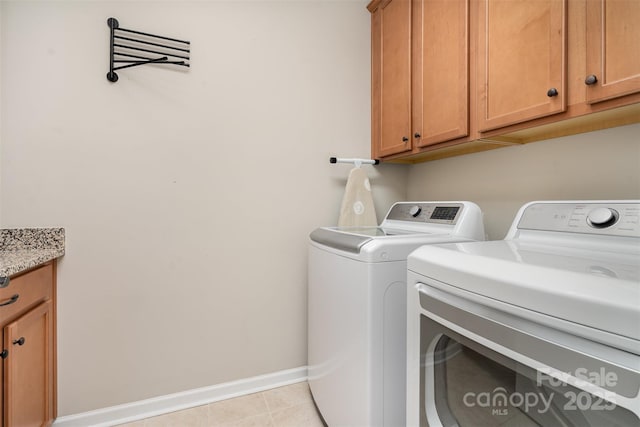 3028 Quinebaug Rd, Fort Mill, SC 29715 - laundry room featuring washing machine and clothes dryer, baseboards, light tile patterned floors, and cabinet space