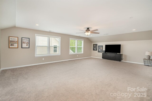 3028 Quinebaug Rd, Fort Mill, SC 29715 - unfurnished living room with vaulted ceiling, a ceiling fan, and light carpet