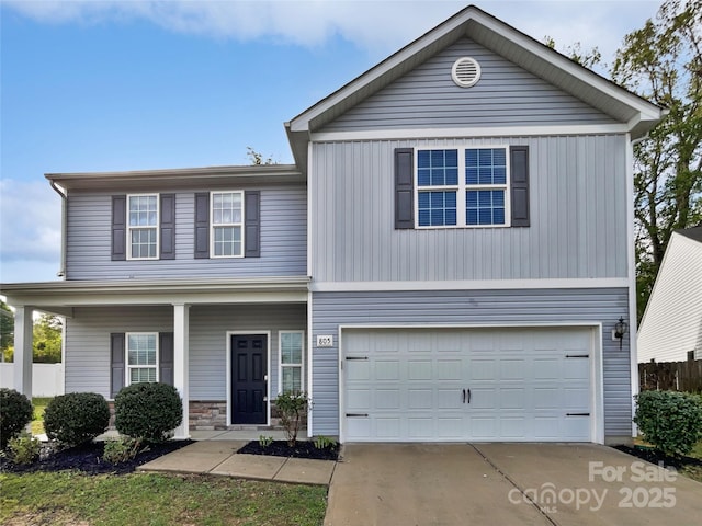 805 Gunnar Dr, Gastonia, NC 28054 - traditional-style home with a garage, a porch, stone siding, and concrete driveway