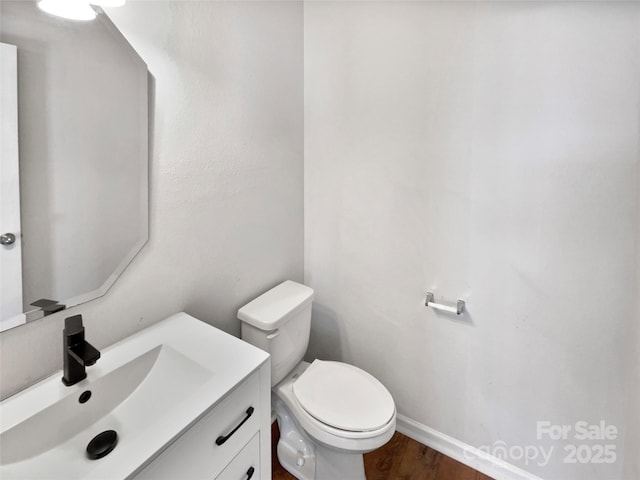 805 Gunnar Dr, Gastonia, NC 28054 - bathroom featuring toilet, wood finished floors, vanity, and baseboards