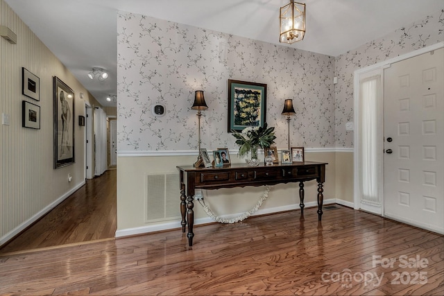 104 Parkway Ct Unit 1, Asheville, NC 28803 - entrance foyer with a chandelier, wood finished floors, wallpapered walls, and visible vents