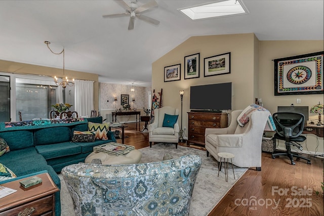 104 Parkway Ct Unit 1, Asheville, NC 28803 - living area featuring vaulted ceiling with skylight, wood finished floors, and ceiling fan with notable chandelier