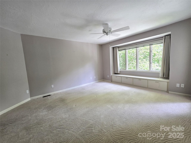 124 Cardinal Rd, Lake Lure, NC 28746 - spare room with a ceiling fan, light colored carpet, and baseboards