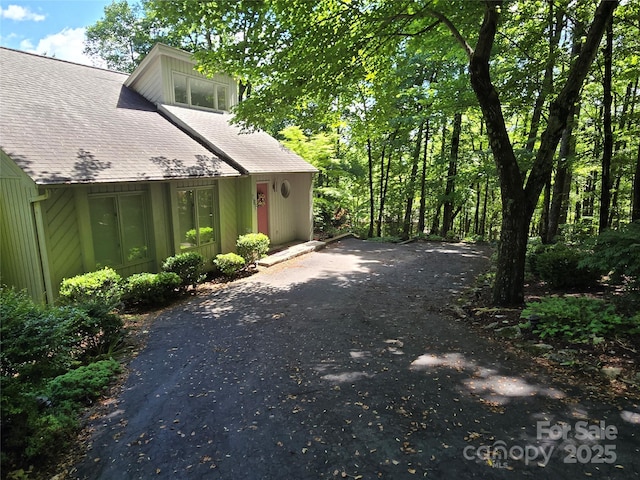 124 Cardinal Rd, Lake Lure, NC 28746 - view of side of home featuring driveway and a shingled roof