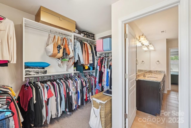 5037 Nighthawk Dr, Fort Mill, SC 29707 - spacious closet with a sink and light tile patterned floors