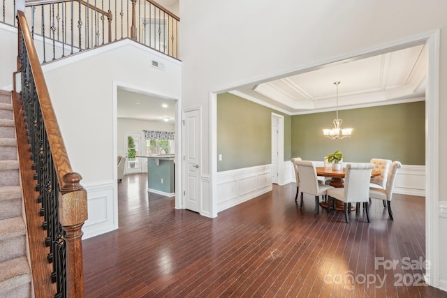 5037 Nighthawk Dr, Fort Mill, SC 29707 - dining area featuring hardwood / wood-style floors, stairway, a chandelier, wainscoting, and ornamental molding