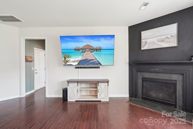 5037 Nighthawk Dr, Fort Mill, SC 29707 - unfurnished living room featuring wood finished floors, baseboards, and a fireplace with flush hearth