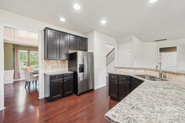 5037 Nighthawk Dr, Fort Mill, SC 29707 - kitchen featuring stainless steel refrigerator with ice dispenser, a sink, dark wood-type flooring, tasteful backsplash, and light stone countertops