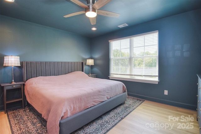 bedroom featuring a ceiling fan, baseboards, recessed lighting, wood finished floors, and visible vents