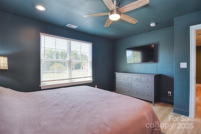 bedroom with a ceiling fan, visible vents, recessed lighting, and light wood finished floors