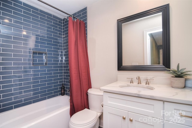 bathroom featuring toilet, shower / bath combination with curtain, and vanity