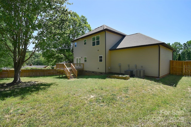 back of property featuring a fenced backyard, a deck, stairway, and crawl space