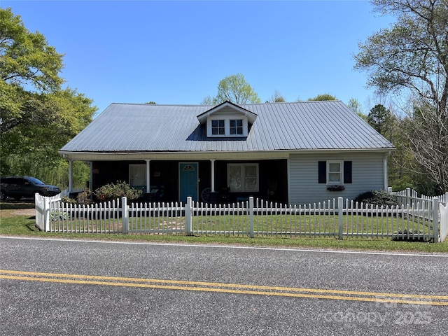 541 Pilgrim Rd, Ellenboro, NC 28040 - view of front of property with a front yard, metal roof, a fenced front yard, and covered porch