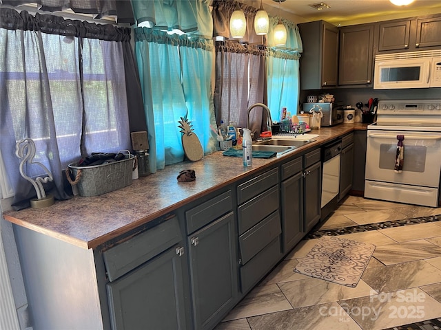 541 Pilgrim Rd, Ellenboro, NC 28040 - kitchen featuring white appliances, gray cabinetry, decorative light fixtures, visible vents, and a sink