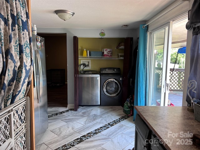 541 Pilgrim Rd, Ellenboro, NC 28040 - clothes washing area with visible vents, washer and clothes dryer, and laundry area