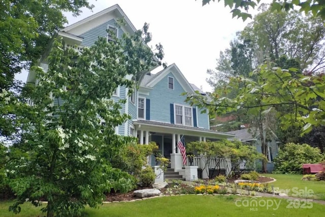 88 S Main St, Weaverville, NC 28787 - view of front facade with a porch and a front lawn
