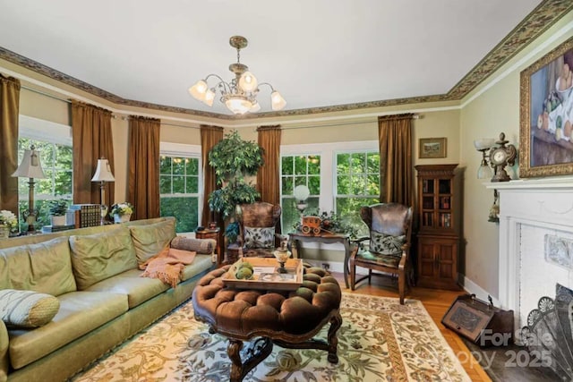88 S Main St, Weaverville, NC 28787 - living room with a fireplace with flush hearth, a notable chandelier, light wood-style flooring, and a healthy amount of sunlight
