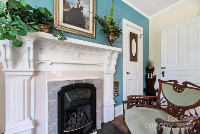 88 S Main St, Weaverville, NC 28787 - sitting room featuring crown molding, dark wood-style flooring, and a fireplace