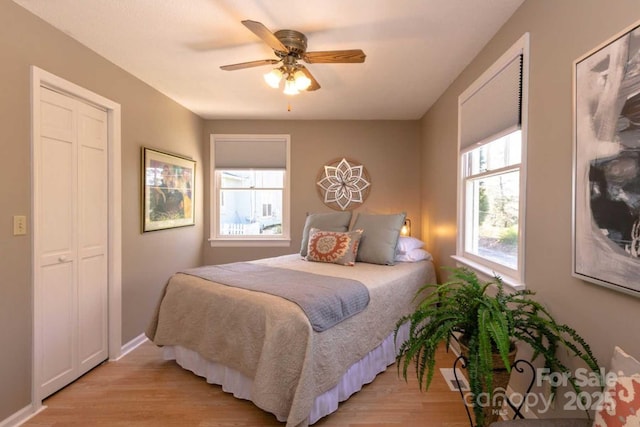 88 S Main St, Weaverville, NC 28787 - bedroom featuring light wood finished floors, baseboards, and a ceiling fan
