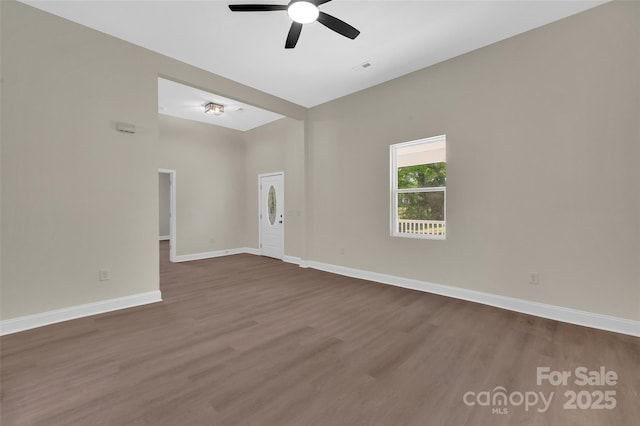 126 Hemphill Ave, Chester, SC 29706 - unfurnished room featuring dark wood-type flooring, ceiling fan, and baseboards