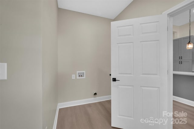 126 Hemphill Ave, Chester, SC 29706 - clothes washing area with washer hookup, wood finished floors, baseboards, and hookup for an electric dryer