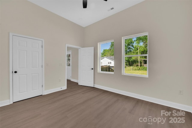 126 Hemphill Ave, Chester, SC 29706 - unfurnished bedroom featuring dark wood finished floors, baseboards, and a ceiling fan
