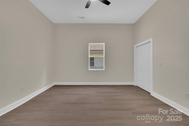 126 Hemphill Ave, Chester, SC 29706 - unfurnished room featuring ceiling fan, dark wood-style flooring, and baseboards