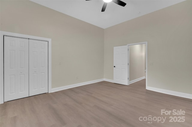 126 Hemphill Ave, Chester, SC 29706 - unfurnished bedroom with wood finished floors, baseboards, a closet, and ceiling fan