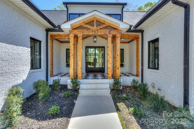 153 High Hills Dr, Mooresville, NC 28117 - property entrance with brick siding, a shingled roof, and a porch
