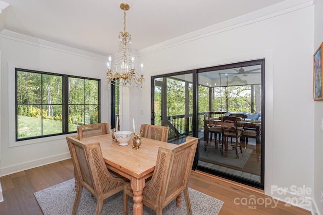 153 High Hills Dr, Mooresville, NC 28117 - dining area featuring a chandelier, wood finished floors, and ornamental molding