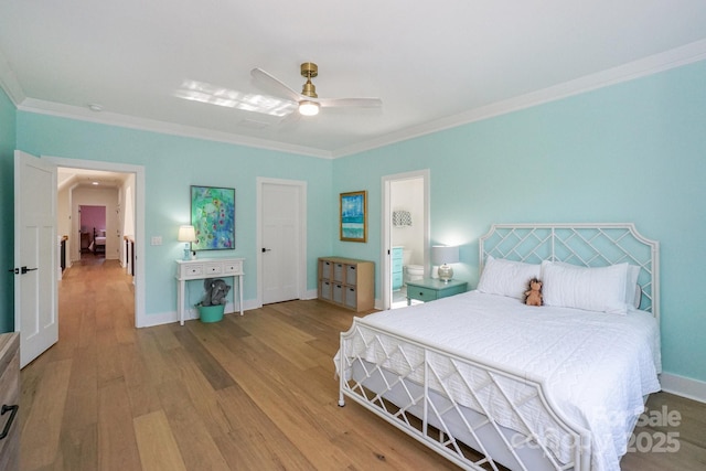 153 High Hills Dr, Mooresville, NC 28117 - bedroom with wood finished floors, ornamental molding, ceiling fan, and connected bathroom