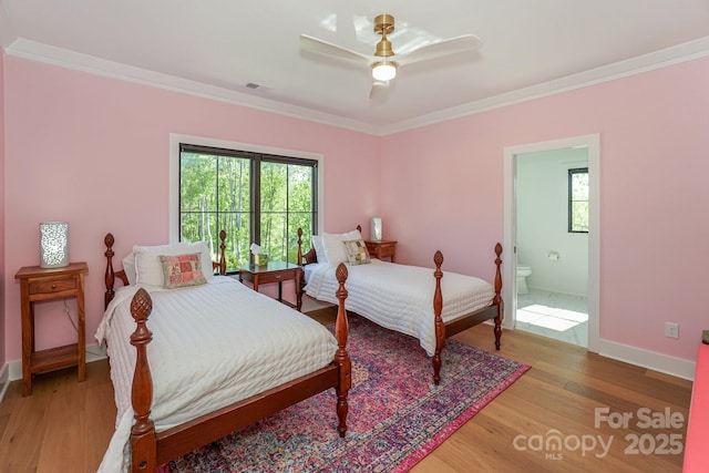 153 High Hills Dr, Mooresville, NC 28117 - bedroom featuring light wood-style flooring, crown molding, connected bathroom, and a ceiling fan