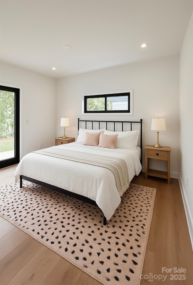 153 High Hills Dr, Mooresville, NC 28117 - bedroom featuring access to outside, multiple windows, wood finished floors, and recessed lighting