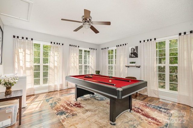 game room with wood finished floors, billiards table, and a ceiling fan