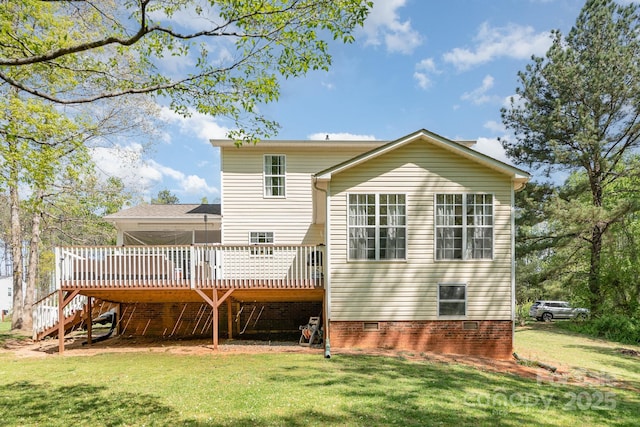 rear view of house with a wooden deck, a yard, crawl space, and stairway