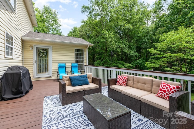 deck featuring an outdoor hangout area and a grill