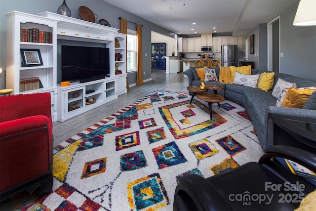 7397 Mill Ruins Ave SW, Concord, NC 28025 - living area with wood finished floors and recessed lighting